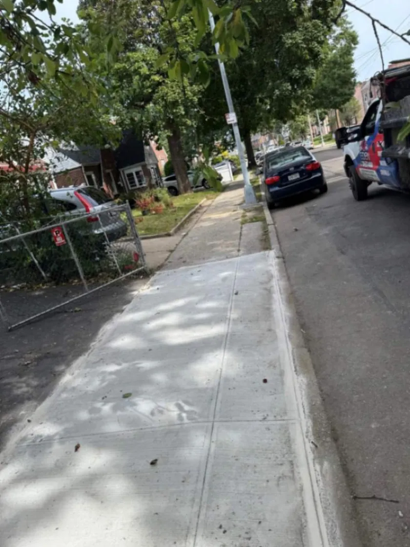 Completed concrete sidewalk replacement in Jamaica, Queens