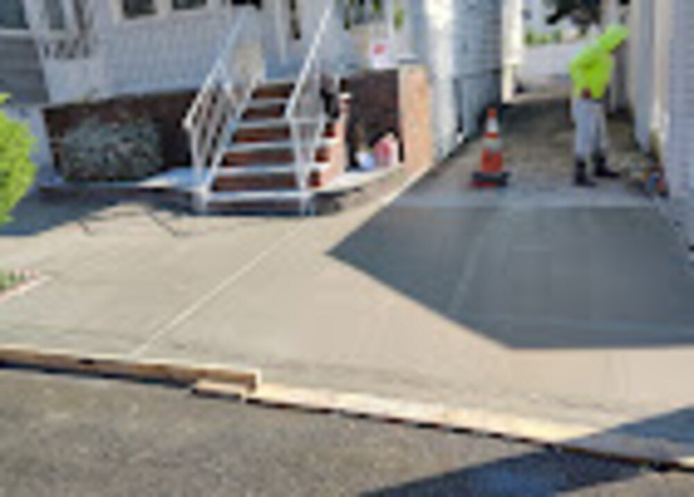 Uneven sidewalk slab showing cracks and repair options